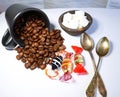 table with coffeebeans glasscandies teaspoons and sugar