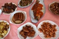 Table covered with many plates with various, delicious and colorful food. Royalty Free Stock Photo