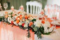 Table decor with white and peach roses. Wedding banquet decoration. Royalty Free Stock Photo