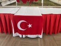 A table decorated with a Turkish flag in a restaurant cafe bar a catering establishment for relaxation in a hotel in a warm Royalty Free Stock Photo