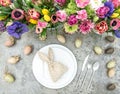 Table decoration colorful spring flowers Easter eggs Royalty Free Stock Photo