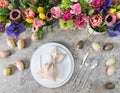Table decoration colorful spring flowers Easter eggs Royalty Free Stock Photo