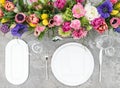 Table decoration colorful spring flowers Holidays place setting Royalty Free Stock Photo