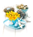 Table decoration with easter eggs nest on plate Royalty Free Stock Photo