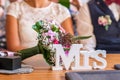 Table decoration Mrs. plate in front of wedding couple during wedding ceremony Royalty Free Stock Photo