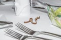 Table decoration of a wedding with glasses of cutlery and the name Eva, Germany Royalty Free Stock Photo