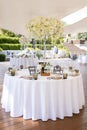 Table decoration with white flowers for guests in a restaurant Royalty Free Stock Photo