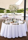 Table decoration with white flowers for guests in a restaurant Royalty Free Stock Photo