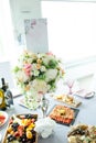 Table decorations made of bouquets of flowers in a vase during catering at a wedding or events Royalty Free Stock Photo