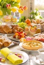 Table with delicatessen ready for Easter brunch Royalty Free Stock Photo