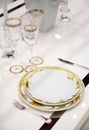 Table with dinner dishes and glasses Royalty Free Stock Photo