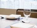 Table Dinner set with plate napkin and glass Restaurant background Royalty Free Stock Photo