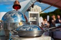 Table with dishware and marmites waiting for guests. Royalty Free Stock Photo