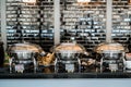 Table with dishware and shiny marmites waiting for guests Royalty Free Stock Photo