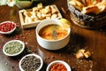 Table Displaying Assorted Bowls of Soup and Fresh Vegetables Royalty Free Stock Photo