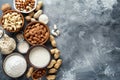 A table displaying various types of nuts stored in bowls, Create a visual representation of common allergens like peanuts, dairy, Royalty Free Stock Photo