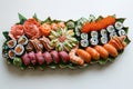 A table displays a variety of sushi rolls and sashimi on a platter, ready to be enjoyed, An intricate sushi platter in pop-art Royalty Free Stock Photo