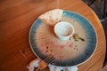 Table after eating with empty plate and remains on it Royalty Free Stock Photo