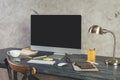 Table with empty white computer monitor side Royalty Free Stock Photo