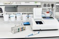 table with equipment and glass test tubes in a chemical laboratory blu