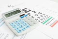 Table for eyesight test and medical prescription form with calculator neat it series Royalty Free Stock Photo