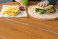 On the table in the fast food restaurant lies a comprehensive lunch, below is a place for your inscription on the background of an Royalty Free Stock Photo