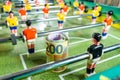 Table football game with rolled up euro bank notes in front of plastic goal keeper, concept of betting and victory