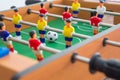 Table football game with yellow and red players and white goalkeeper Royalty Free Stock Photo