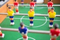 Table football game with yellow and red players and white goalkeeper. Royalty Free Stock Photo