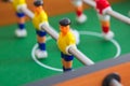 Table football game with yellow and red players and white goalkeeper. Table soccer game. Royalty Free Stock Photo