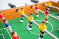 Table football game with yellow and red players and white goalkeeper. Table soccer game. Royalty Free Stock Photo
