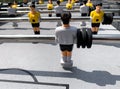 Table football game with yellow and white players