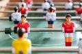 Table football soccer game - close up to the players wearing red shirt