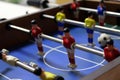 Table football soccer game kicker. sports team players in red and yellow t-shirts Royalty Free Stock Photo