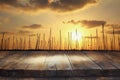 table in front of abstract blurred yachts at sunset Royalty Free Stock Photo