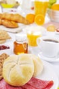 Table full with continental breakfast items, brightly lit Royalty Free Stock Photo