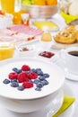 Table full with continental breakfast items, brightly lit Royalty Free Stock Photo