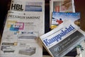 Table full of finnish newspapers, print media