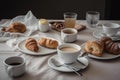 A table with a table full of food and cups of coffee and croissants. AI generation