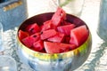 Table full of food, fresh drinks, bowl full of watermelon.