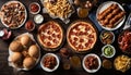 A table full of food including pizza, fries, and chicken wings Royalty Free Stock Photo