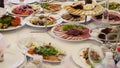 Table full of food. Served tables in restaurant Royalty Free Stock Photo