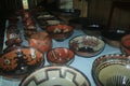 A table full of home made ceramic bowls, a typical design of the mockawas in the amazon of Ecuador