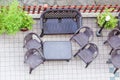 Table and garden chair from above . Sunny patio with table and chairs, high angle view Royalty Free Stock Photo