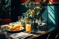 a table with a glass of orange juice and a plate of lemons Royalty Free Stock Photo