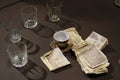 Table with glasses, coffee cup and money