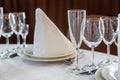 Table with glasses and napkins served for dinner in restaurant Royalty Free Stock Photo