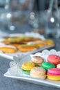 macarons on the festive table. Plate with openwork napkin. close up Royalty Free Stock Photo