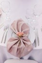 Table holiday service. Elegant pink napkin. Beautiful serving dishes for dinner Royalty Free Stock Photo