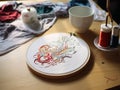 On the table, hoop, overfinger to embroider motifs